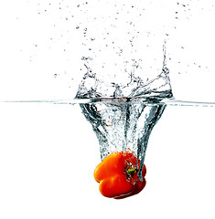 Image showing Pepper drops into a water 