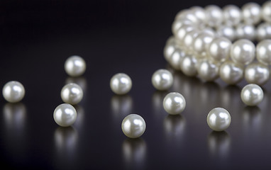 Image showing White pearls necklace on black