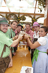 Image showing Oktoberfest visitors drink beer