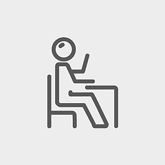 Image showing Student sitting on a chair in front of his table thin line icon