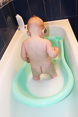 Image showing little baby takes a bath