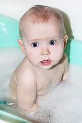 Image showing little baby takes a bath