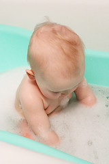 Image showing little baby takes a bath