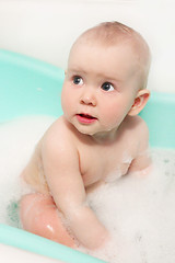 Image showing little baby takes a bath