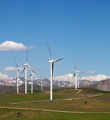 Image showing Wind farm at sun spring day