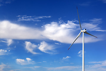 Image showing Wind turbine and blue sky with clouds