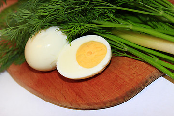 Image showing sliced boiled egg, green onions and dill