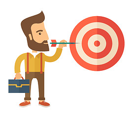 Image showing Working man holding a target arrow 