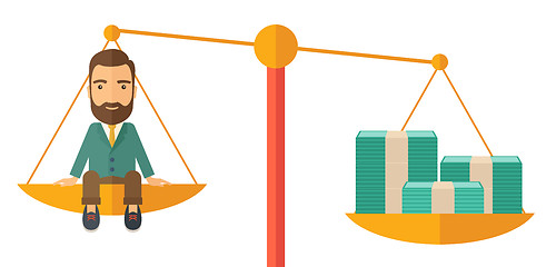 Image showing Businessman on a balance scale