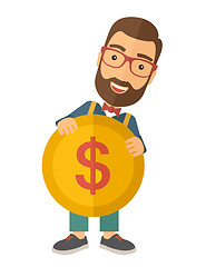 Image showing Businessman holding a big coin