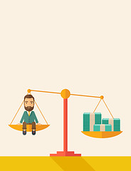 Image showing Businessman on a balance scale