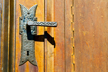 Image showing castellanza blur  rusty brass brown knocker d wood  
