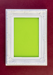 Image showing White Frame on dark red 