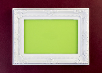 Image showing White Frame on dark red 