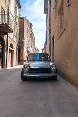 Image showing old retro car in a narrow streets of the city