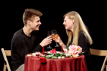 Image showing Portrait Of Romantic Couple Toasting white Wine At Dinner