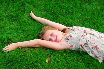 Image showing Young girl grass