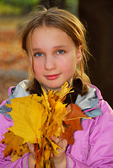 Image showing Girl with leaves