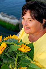 Image showing Mature woman flowers