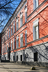 Image showing Facade of old red building with architectural decorations