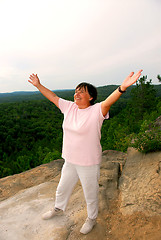 Image showing Mature woman cliff