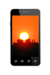 Image showing Modern smart-phone with picture of sunset on white