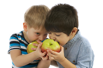 Image showing Two Boys Eating Apples