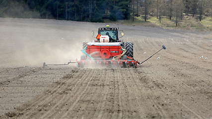 Image showing Valmet 8550 Tractor and Seeder on Field at Spring