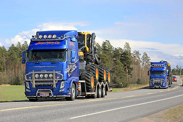 Image showing Two Volvo FH Trucks Haul Ponsse Forestry Machinery