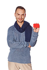 Image showing Smiling casual man showing blank credit card