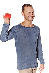 Image showing Smiling casual man showing blank credit card