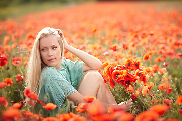 Image showing Beautiful woman on poppy flower field