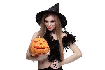 Image showing Girl in witch costume with Halloween pumpkin