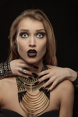 Image showing Gothic woman with hands of vampire on her neck