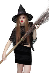 Image showing Girl in witch costume with a broom. 2