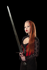 Image showing Portrait of gorgeous redhead woman with long sword