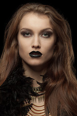 Image showing Closeup portrait of a gothic femme fatale with black lips