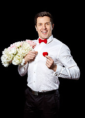 Image showing The elegant man with a ring and flowers
