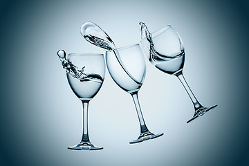 Image showing Three water glasses splash