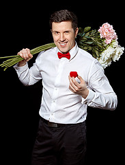 Image showing The elegant man with a ring and flowers