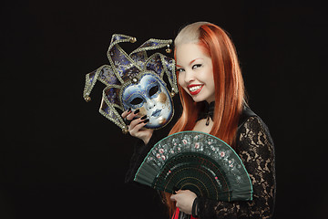 Image showing Gothic girl with fan and a mask