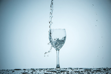 Image showing glass being filled with water 