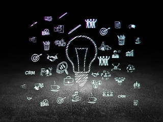 Image showing Business concept: Light Bulb in grunge dark room