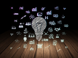 Image showing Business concept: Light Bulb in grunge dark room