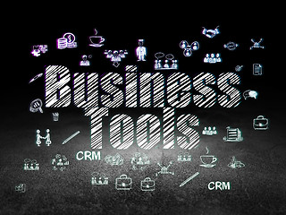 Image showing Business concept: Business Tools in grunge dark room