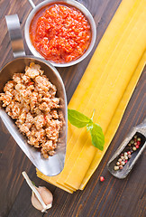 Image showing dough for lasagna and ingredients for lasagna