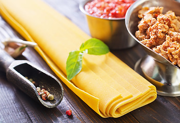 Image showing dough for lasagna and ingredients for lasagna