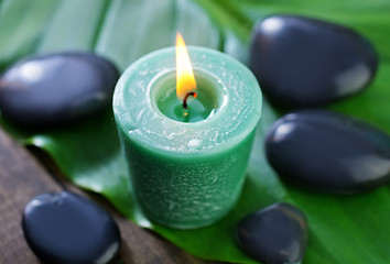 Image showing candle and stones