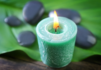 Image showing candle and stones