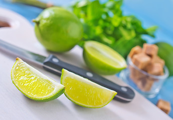 Image showing fresh limes with sugar and mint